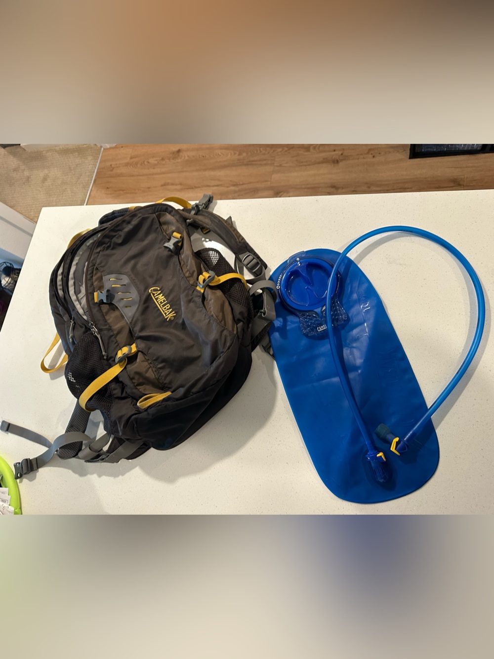 CamelBak Black Backpack with Yellow Accents and Blue Hydration Bladder